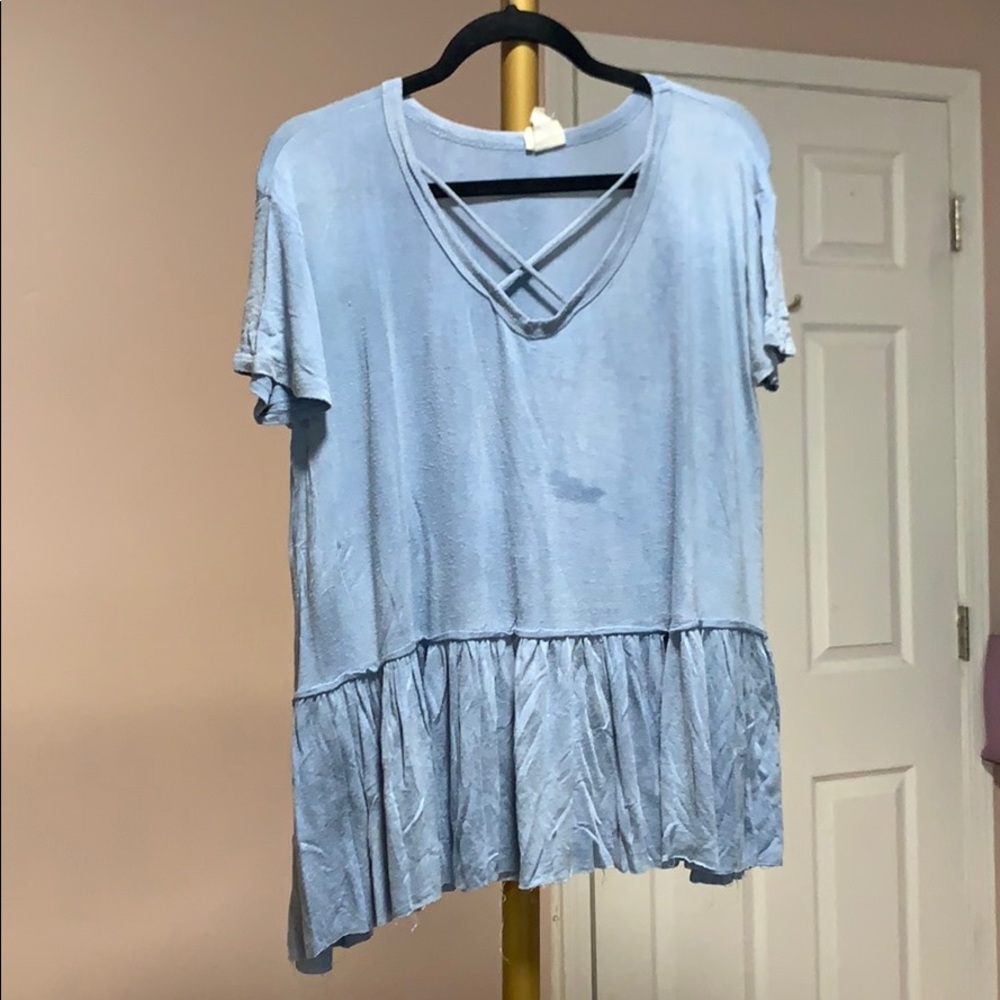 Blue tee with ruffles at the bottom